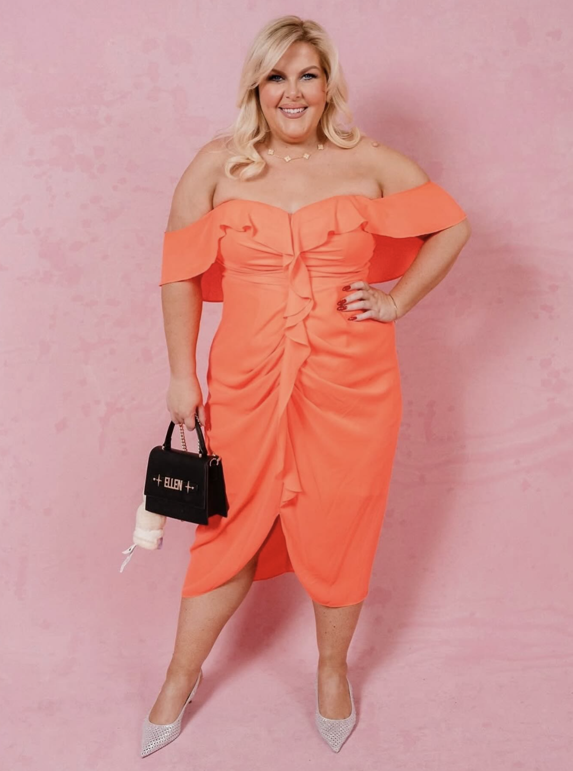 Client confidence in a coral event dress